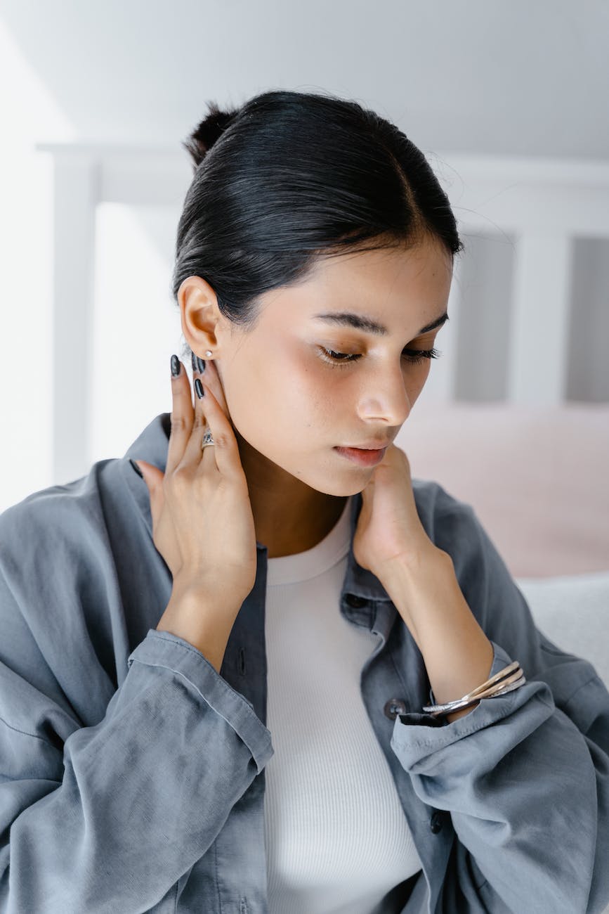 a woman massaging her neck